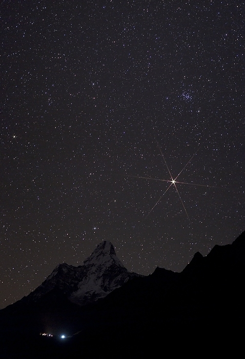 Mars rising over the Himalayas Mars rising over the Himalayas. View across the Himalayas towards the planet Mars  bright  rising over Ama Dablam  highest peak  in Sagarmath National Park, Nepal. The star cluster M44, or the Beehive,  upper right  is visible above Mars.