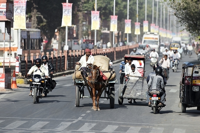 Road traffic in India Road traffic in India. Motorbikes and horse drawn and human operated carts and vehicles on a road in Jaipur, Rajasthan, India. Photographed in March 2013.