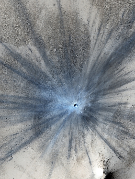 Young impact crater on Mars Young impact crater on Mars. Mars Reconnaissance Orbiter image of an impact crater formed between July 2010 and May 2012. The crater measures approximately 30 metres in diameter and ejecta is dispersed as far as 15 kilometres in the distance. Image obtained by the High Resolution Imaging Science Experiment  HiRISE  camera on 19th November 2013.