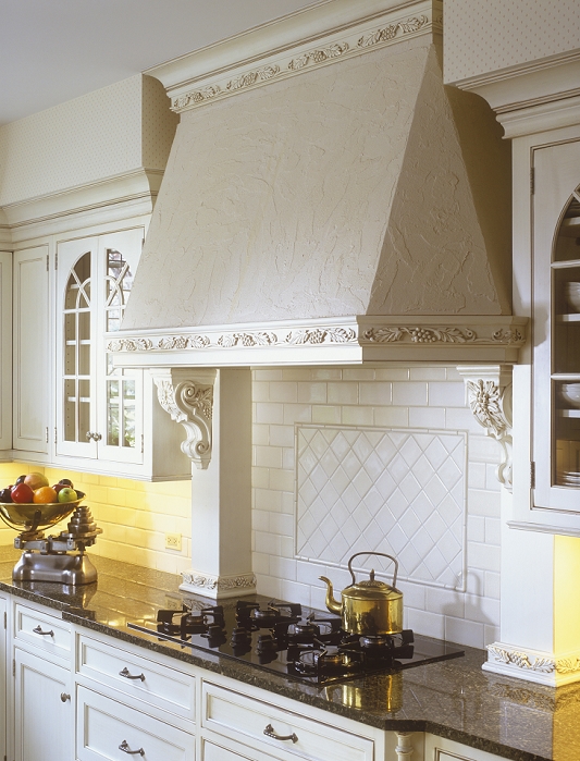 KITCHEN - Classic contemporary traditional design. subway tile, black counter, range hood with corbels, scale with fruit