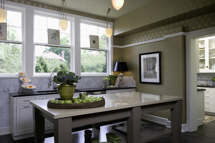 KITCHENS: Horizontal  monochromatic mixed style of Victorian motifs in the wallpaper and pendant lighting and new contemporary in the moveable island that resembles a  table, granny smith apples, flowering kale, pantry through doorway