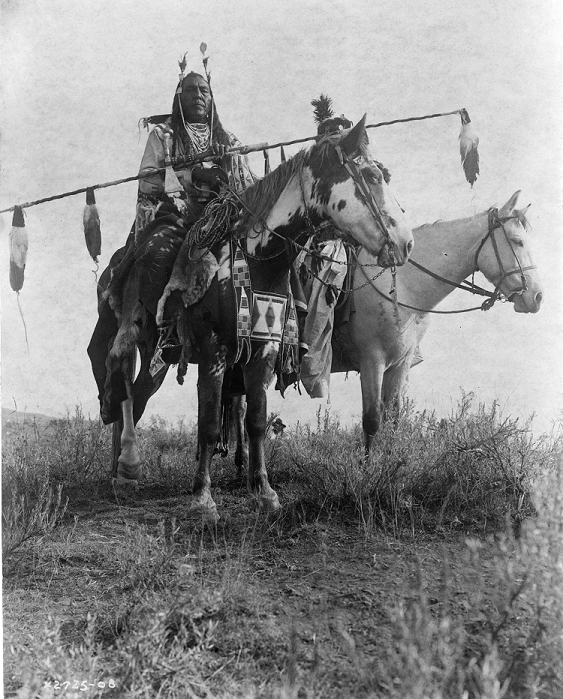 Village criers on horseback, Bird On the Ground and Forked Iron, Crow Indians, Montana,1908 Photograph by Edward Curtis (1868-1952).