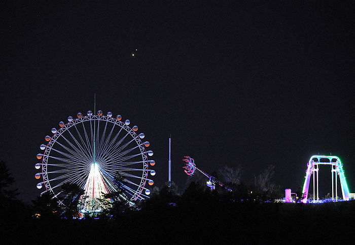 Jupiter and Saturn make their first close encounter in about 400 years Saturn  above  and Jupiter are aligned at their closest approach in 397 years. Below is a Ferris wheel at Lake Sagamihara Resort Pleasure Forest and other facilities in Midori ku, Sagamihara, December 2, 2020. Photo by Koichiro Tezuka at 5:44 p.m. on December 1.