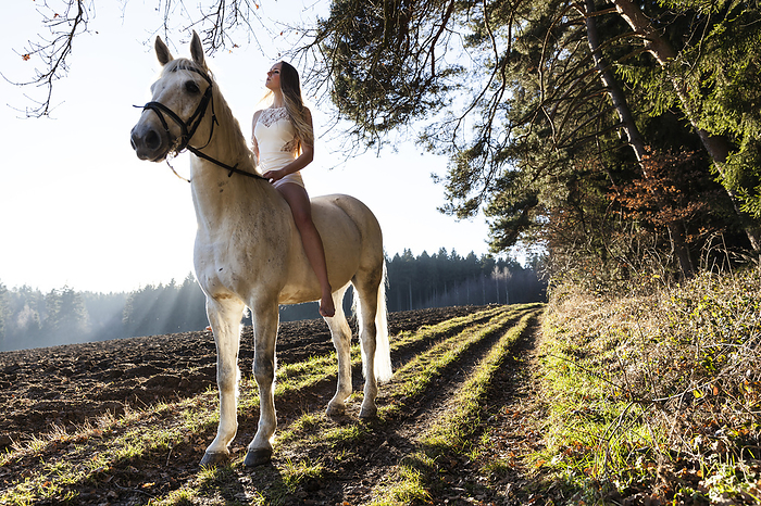 girl in a white dress riding her horse, Freising, Bavaria, Germany, Photo by Feder, Wilfried