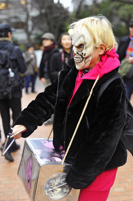 One year after the Great East Japan Earthquake Anti nuclear power plant demonstration in Tokyo Tokyo, Japan   March 11: A woman with a scary mask participated in a demonstration against nuclear power plants at Chiyoda, Tokyo, Japan on March 11, 2012. As this day was one year anniversary of Great East Japan Earthquake and Tsunami, there were many demonstrations held in the city.