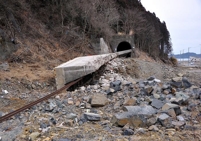 One Year after the Great East Japan Earthquake Progress in the Recovery of the Affected Areas March 8, 2012, Minamisannriku cho, Japan   A huge concrete slab remains over the local railroad track at Minamisannriku cho, Miyagi Prefecture, some A huge concrete slab remains over the local railroad track at Minamisannriku cho, Miyagi Prefecture, some 365 km northeast of Tokyo, on Thursday, March 8, 2012.  One year after the strongest earthquake ever to hit Japan, the economy is recovering and massive cleanup operations are in full swing throughout much of the country s northeastern region. But once pastoral landscapes that were piled with rubble and debris have become empty wastelands due mainly to bickering and disagreements. A year later, more than 260,000 people still live in temporary shelters. A year later, more than 260,000 people still live in temporary shelters.  Photo by Natsuki Sakai AFLO  AYF  mis 