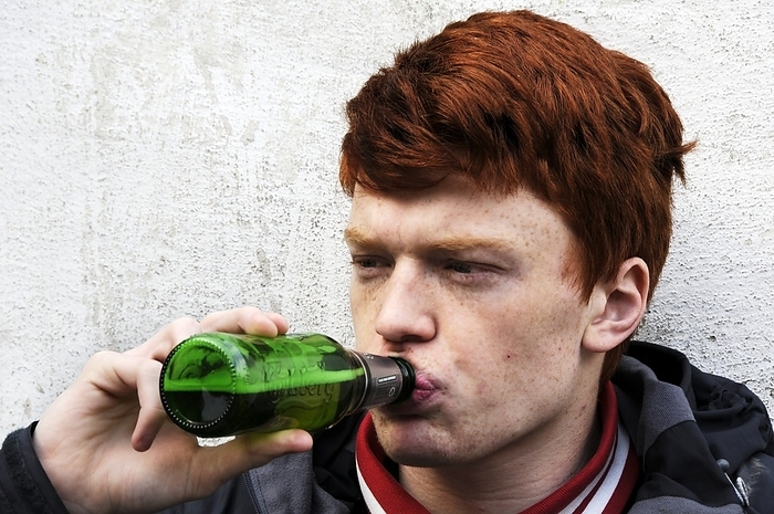 Teenager drinking beer Teenager drinking beer. 18 year old teenage boy drinking bottled beer.