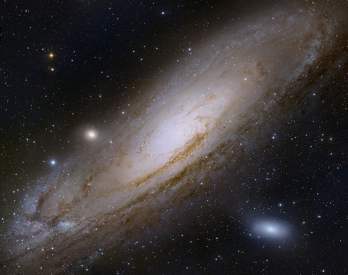 Andromeda Galaxy Andromeda Galaxy. Composite image of the Andromeda Galaxy  M31  NGC 224 . This galaxy is 2.2 million light years from Earth in the constellation Andromeda. At 200 light years across it is the largest galaxy in the  local group , a cluster of about 25 galaxies that includes our own, the Milky Way. Like the Milky Way, Andromeda is a spiral galaxy with a dense central bulge packed with millions of stars. Here, two small companion galaxies are also seen: the irregular galaxy M110  lower right  and the elliptical galaxy M32  star like object just left of Andromeda s centre . Image data from 8.2 Meter Subaru Telescope  NAOJ , Digitized Sky Survey, and the Hubble Space Telescope.