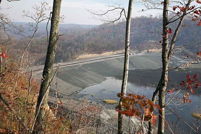 Coal sludge dam, West Virginia, USA Coal sludge impoundment dam. Impoundments hold liquid and solid wastes from the coal mining process, including toxic chemicals that can seep into local water supplies. Photographed in Sylvester, West Virginia, USA.