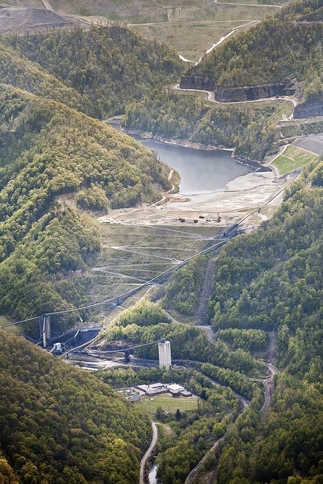 Coal sludge dam, West Virginia, USA Coal sludge impoundment dam, aerial photograph. Impoundments hold liquid and solid wastes from the coal mining process, including toxic chemicals that can seep into local water supplies. Photographed in Whitesville, West Virginia, USA.