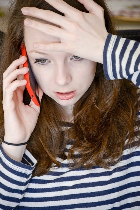 Teenage cyberbullying Teenage cyberbullying. 16 year old girl feeling upset as she receives an insulting telephone call. Cyberbullying is the use of information technology to harm or harass other people in a deliberate, repeated, and hostile manner. It can range from sending rumours or gossip, to publishing defamatory and humiliating material.