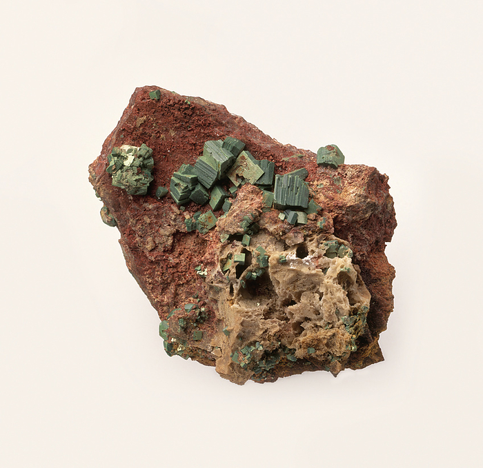 Torbernite in iron rich groundmass Torbernite crystals in iron rich groundmass, close up