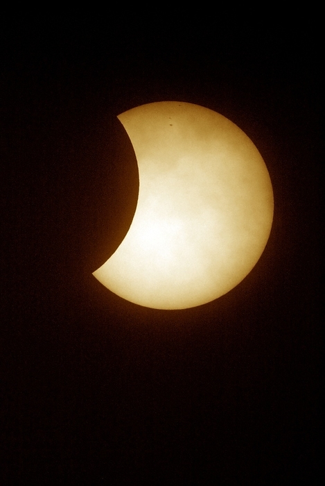Partial solar eclipse Partial solar eclipse. View of the Sun during a partial solar eclipse. Solar eclipses occur when the Moon passes between the Sun and the Earth and fully or partially blocks the Sun.