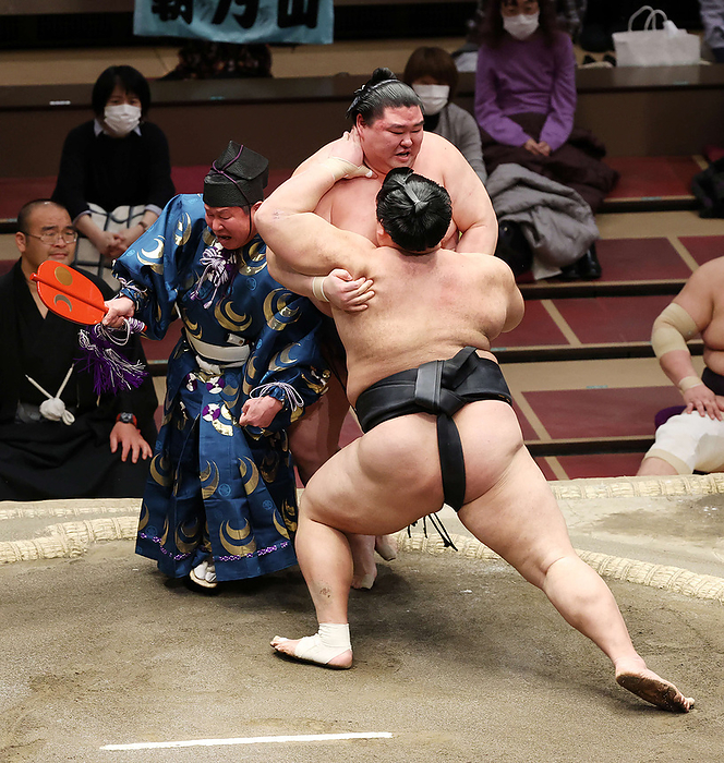 Grand Sumo Tournament, 1st day of the tournament, Chishuuraku Masashiro bumps Inosuke Shikimori  left  during his bout with Asanoyama  front , January 24, 2021 date 20210124 place Ryogoku Kokugikan