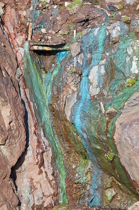 Sea Cliffs stained green from copper Sea Cliffs stained green from copper deposits leaching from the old Geevor Tin Mine near St Just in Cornwall, UK.