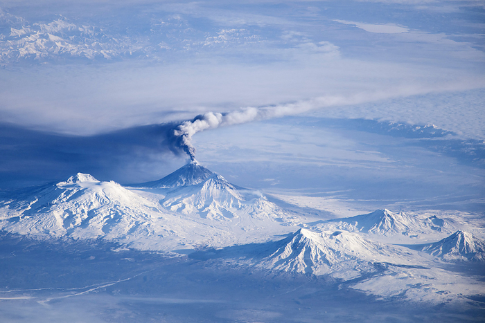 Klyuchevskoy volcano astronaut photograph Klyuchevskoy volcano. Aerial view of the Klyuchevskoy volcano, Kamchatka Peninsula, Russia, during an eruption. Klyuchevskoy is one of the many active volcanoes on the Kamchatka Peninsula. It is the highest mountain on the Kamchatka Peninsula and the highest active volcano in Eurasia. Photographed by the Expedition 38 crew onboard the International Space Station  ISS , on 16th November 2013.