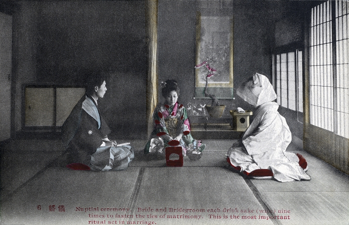 Marriage  date of photograph unknown  Japanese Marriage: The bride and groom seal the marriage with sake during an arranged marriage  omiai . This image comes from a series of cards about Japanese marriage customs.Original text  Card 6 :  Nupital ceremony. Bride and Bridegroom each drink sake  wine  nine times to fasten the ties of matrimony.  This is the most important ritual act in marriage. 