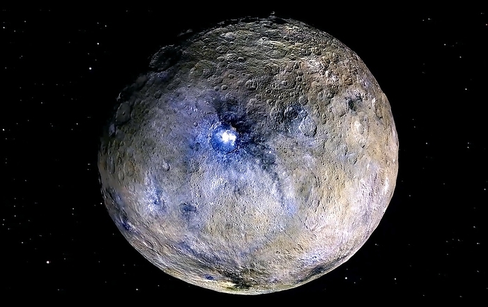 Ceres, satellite image Ceres. False colour satellite image of the dwarf planet Ceres, showing the difference in materials covering its surface and the Occator impact cater  round  at centre. Ceres is the largest object in the asteroid belt, which lies between the orbits of Mars and Jupiter. Imaged by the Framing Camera on NASA s Dawn space probe.