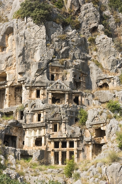 Ancient city of Myra Myra, an ancient Greek town in Lycia in present day Antalya, Turkey. The ruins of the Lycian and Roman town are mostly covered by aluvial silts. The Acropolis on the Demre plateau, the Roman theatre and the Roman baths have been partly excavated. There are two necroplois  of Lycian rock cut tombs in the form of temple fronts carved into the vertical faces of the cliffs at Myra. Andriake was the harbour of Myra in classical times, but silted up later on. The main structure that survives to the present day is a granary  horrea  built during the reign of Roman Emperor Hadrian  117   138 CE . Beside this granary is a large heap of murex shells, evidence that Andriake was very invovled in the production purple dye.
