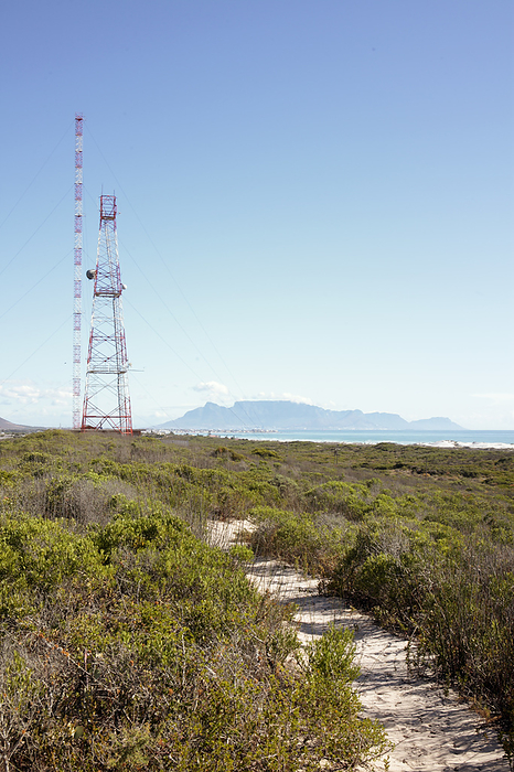 Communications tower, South Africa Communications tower. View past a communications tower at Koeberg Nuclear Power Station, Western Cape, South Africa   Africa s only nuclear power station   towards Table Mountain on the horizon.