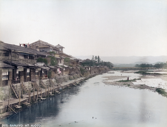 Kamogawa River  unknown date  A beautiful view of restaurants and inns along the Kamogawa River in Kyoto. This photo was most probably taken from Sanjo Ohashi. The bridge in the back is probably Nijo hashi.