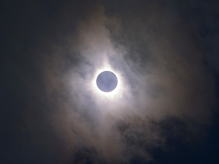 Total solar eclipse, March 2016 Total solar eclipse seen through clouds. Total solar eclipses occur when the Moon passes directly in front of the Sun. The shading of the disc of the Sun reveals its corona, the sun s atmosphere. This is normally not visible due to the brightness of the solar disc. Total solar eclipses usually occur less than once a year, and can only be seen from a small area of the Earth s surface. This total solar eclipse was observed from Ternate in Indonesia s Maluku Islands on 9 March 2016. Totality at this location occurred for around 2.5 minutes between 09:51:40 and 09:54:19 local time.
