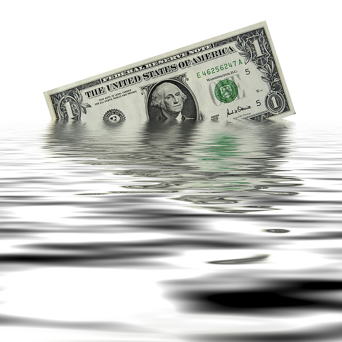 US dollar crisis, conceptual image US dollar crisis, conceptual image. One dollar bill sinking in water, representing a crisis in the US dollar  USD  such as devaluation, a debt crisis or a run on the banks. The US dollar is the world s most used reserve currency, with many countries using it as a reliable safe haven for their currency reserves.