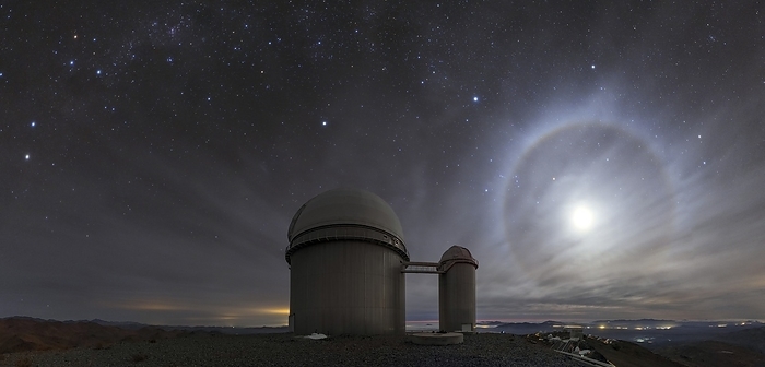 Moon halo and La Silla Observatory, Chile Moon halo and La Silla Observatory. Panoramic image of a lunar halo in the night sky over one of the telescope buildings of La Silla Observatory in the Atacama Desert, Chile. La Silla is located at an altitude of 2400 metres and is operated by the European Southern Observatory  ESO . Lunar halos are an optical phenomena that form when moonlight passes through ice crystals in the sky, usually from cirrostratus clouds or fog.
