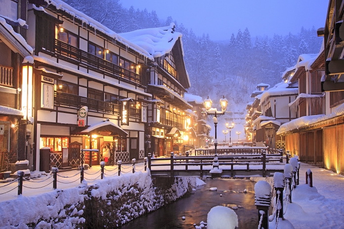 Japan Yamagata Prefecture Evening view of Ginzan Onsen in the snow