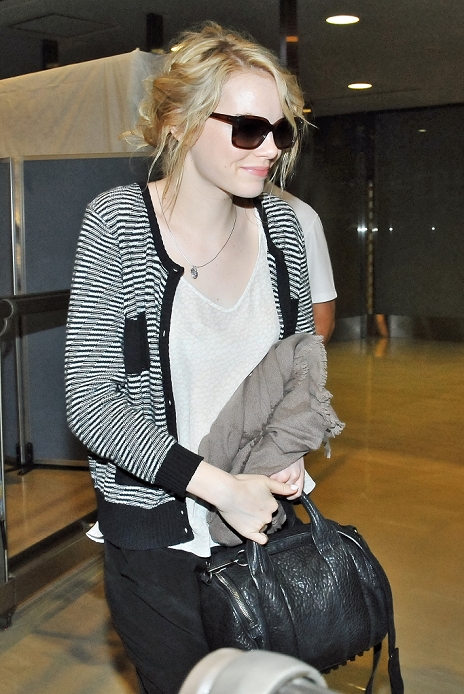 Emma Stone, Jun 12, 2012 : Actress Emma Stone and actor Andrew Garfield arrive at Narita International Airport in Chiba prefecture, Japan on June 12, 2012.
