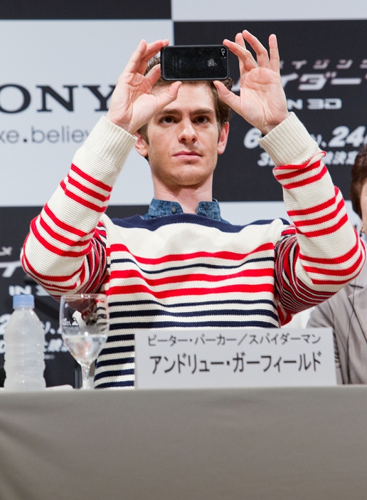 Andrew Garfield, Jun 13, 2012 : Tokyo, Japan - Actor Andrew Garfield takes a photo of the audience with his Apple iPhone during the press conference for the film 