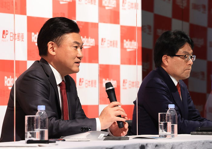 Rakuten and Japan Post Holdings annouce their business and capital tie up March 12, 2021, Tokyo, Japan   Japan s e commerce giant Rakuten president Hiroshi Mikitani  L  and Japan Post Holdings president Hiroya Masuda  R  announce their business and capital tie up at a press conference in Tokyo on Friday, March 12, 2021. Japan Post Holdings will inject 150 million yen to Rakuten and get 8.32 percent stake of Rakuten.                Photo by Yoshio Tsunoda AFLO 