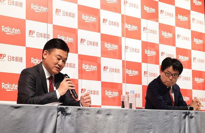 Rakuten and Japan Post Holdings annouce their business and capital tie up March 12, 2021, Tokyo, Japan   Japan s e commerce giant Rakuten president Hiroshi Mikitani  L  and Japan Post Holdings president Hiroya Masuda  R  announce their business and capital tie up at a press conference in Tokyo on Friday, March 12, 2021. Japan Post Holdings will inject 150 million yen to Rakuten and get 8.32 percent stake of Rakuten.                Photo by Yoshio Tsunoda AFLO 