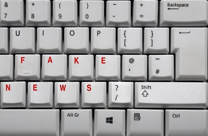 Fake news, conceptual image Fake news, conceptual image. Computer keyboard with the words  fake news  in red, representing the rise in misleading and fictitious stories on the internet, masquerading as news.