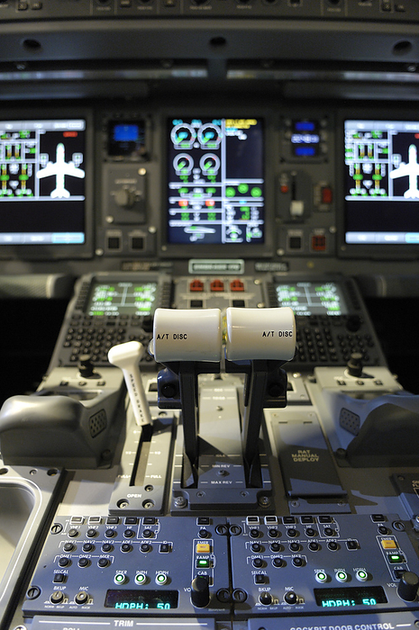 Narrow body passenger aircraft cockpit Throttle levers and instruments during the delivery roll out ceremony of the first Embraer 170 E Jet for British Airways BA CityFlyer.