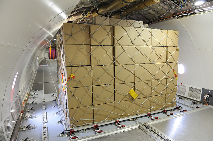 Cargo plane hold Boxes with cargo net on pallet inside A330 200F prototype. Photographed at the Singapore Airshow, 2010.