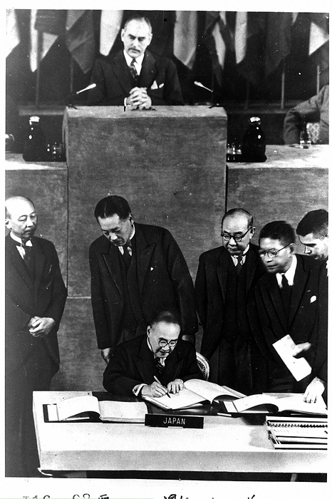 Shigeru Yoshida, Chief Plenipotentiary, signs the peace treaty. Plenipotentiary Shigeru Yoshida signs the San Francisco Peace Treaty. Surrounding him are the Japanese plenipotentiaries, from left: Muneyoshi Tokugawa, Jiro Hoshijima, Yoshizo Tomabechi, and Hayato Ikeda, September 8, 1951.