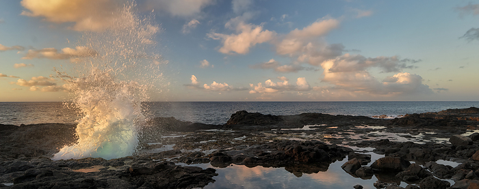 Spouting Horn blow hole at sunrise. Kauai, Hawaii