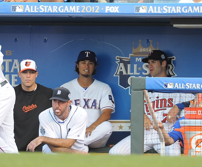 2012 MLB All Star  Yu Darvish  American , JULY 10, 2012   MLB : American League s Yu Darvish of the Texsas Rangers talks with his teammate Joe Mauer  R  of the Minnesota Twins in the dugout as Justin Verlander  2nd L  of the Detroit Tigers chews gum in front of them during the MLB All Star Game at Kauffman Stadium in Kansas City, Missouri Kansas City, Missouri, United States.