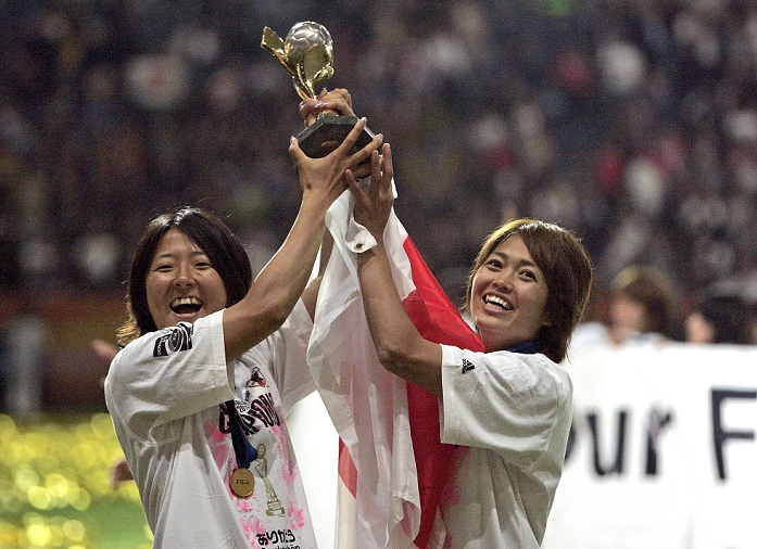 2011 FIFA Women s World Cup Nadeshiko Japan wins first place  L R  Yuki Nagasato, Kozue Ando  JPN , JULY 17, 2011   Football   Soccer : Yuki Nagasato and Kozue Ando of Japan celebrate with the trophy after Yuki Nagasato and Kozue Ando of Japan celebrate with the trophy after winning the FIFA Women s World Cup Germany 2011 Final match between Japan 2 3 1 2 United States at Commerzbank Arena in Frankfurt, Germany. AFLO 