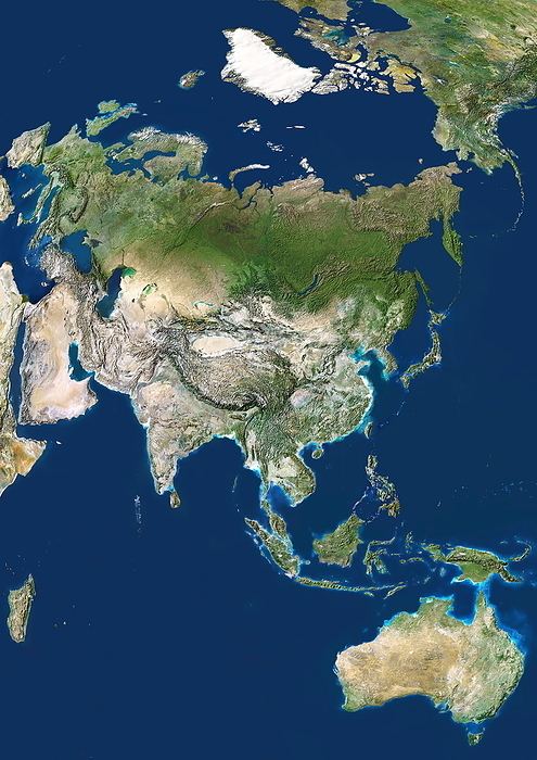 Asia Asia. Satellite image centred on Asia. The North Pole is at upper right. Water is blue, vegetation is green, arid areas are brown, and snow and ice are white. The terrain of Asia varies from deserts  brown, central and southern Asia , to tropical rainforests  dark green, South East Asia and the Malay Archipelago , to grasslands, forests and tundra  lighter green, northern Asia , and mountain ranges  centre . Also seen is Europe  upper left , Greenland  white, top centre , part of North America  top right , part of the Pacific Ocean  right , Australia  bottom right , and the Indian Ocean and the island of Madagascar  lower left . For this area at night, see E074 054.