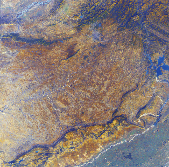 North eastern Pakistan North eastern Pakistan, true colour satellite image. North is at top. Water is blue, barren land   rock are brown and vegetation is green. This is the sandy and eroded Potwar Plateau, rising above the green fields of the Punjab Plain  bottom right . The plateau is bounded by the Jhelum River  lower right  and the Indus River  top left . The Sohan River flows past the capital city Islamabad  grey, just north of the city of Rawalpindi, upper centre , down to lower left. Mountain foothills rise at upper right. This 185  kilometre wide image was taken on 13 November 1994 by the Thematic Mapper  TM  sensor on NASA s Landsat 5 satellite.