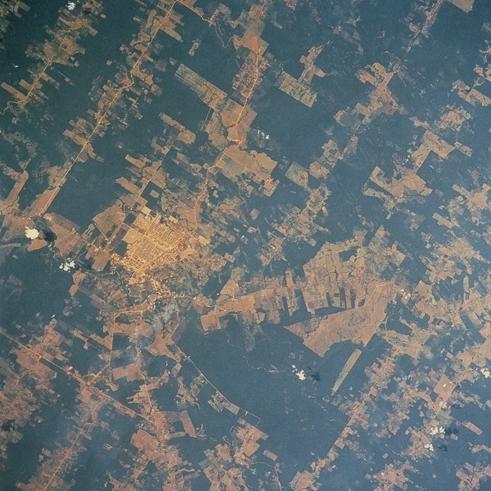 Deforestation in Brazil, seen from Shuttle STS 46 Deforestation in Brazil seen from space. View of part of the Polonoroeste Resettlement Project area in Rondonia State, Brazil. Scenes from Skylab missions in 1973 4 showed this area of the Amazon Basin to be virgin rain forest. In the late 1970s, the Brazilian Government designated the area as a resettlement region for people from the drought  prone north east and urban south. The region, equal to 80  of the size of France, now shows extensive deforestation alongside main and side roads and river courses. The extent of loss of the rain forest is greater than in views taken in May 1985  Mission 51 G . This view was obtained from Shuttle Mission STS 46, 31 July   8 August 1992.