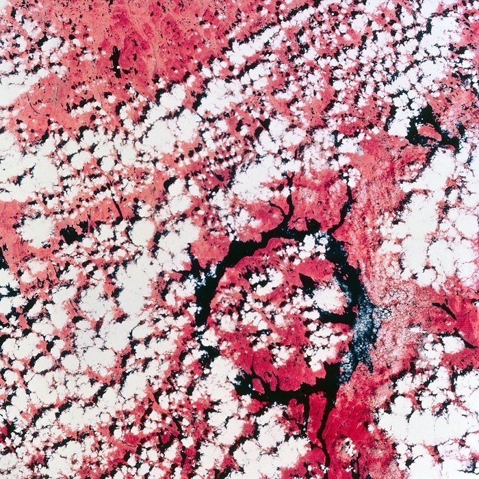 Giant meteorite crater in Quebec Infrared space photograph of the giant Manicouagan meteorite crater in Quebec, Canada. The crater, which is clearly marked by the ring shaped lake  black  around its rim, is believed to have been produced by the impact of a massive meteorite. The photograph was taken from the American Skylab orbiting laboratory.