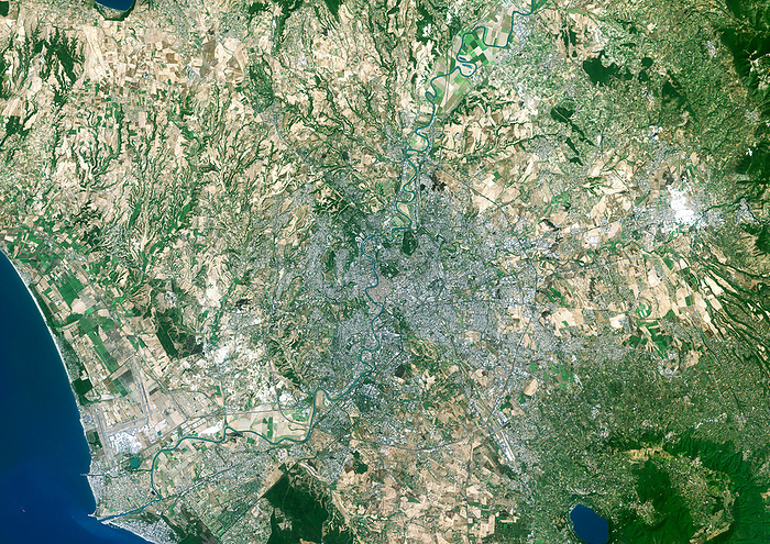 Rome, satellite image Rome, satellite image. North is at top. Vegetation is green, bare ground is brown, urban areas are grey and water is blue. Rome is the capital city of Italy. It is situated on the banks of the river Tiber  northeast to southwest  on the coast of the Mediterranean Sea. Lake Albano is at bottom right and the Alban Hills are to its right.