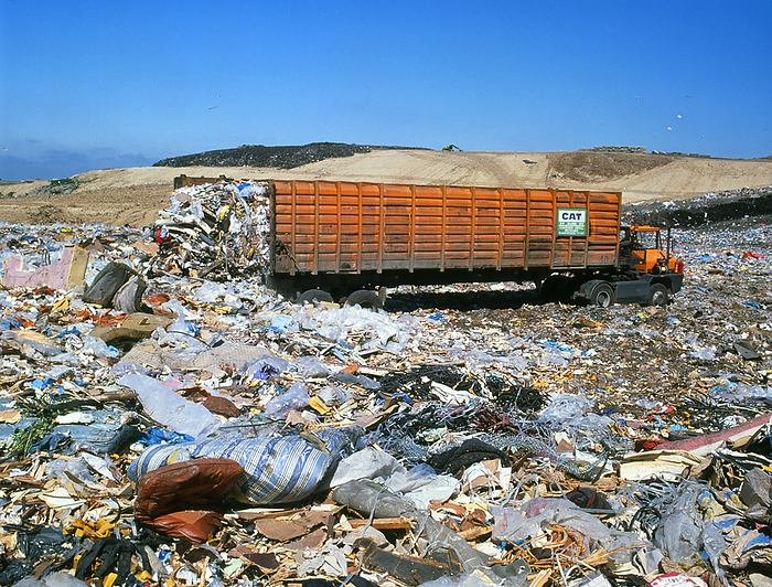 Landfill site with waste truck dumping refuse Waste landfill site. Waste truck dumps domestic refuse at a landfill site. Landfill sites are used to dispose of about 90  of the world s domestic waste. The type of material dumped must be controlled to prevent chemical toxins leaching into local groundwater. Leaching may also be prevented by lining the site with synthetic materials or impermeable clay. In time the dump may be covered with soil, landscaped, and the land sold to developers.
