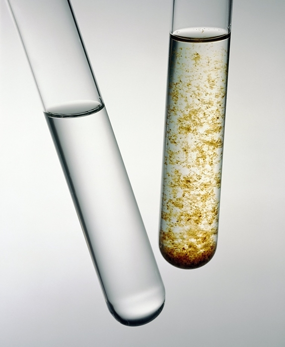 Two test tubes of contaminated water Water analysis. Two test tubes of contaminated water. The tube on the right is contaminated with visible sediment. The tube on the left is clear but contains invisible contaminants such as microorganisms or chemicals. Chemical pollutants in water supplies can be from industrial discharges or from agricultural fertilisers or pesticides leaching out of fields into surrounding rivers.