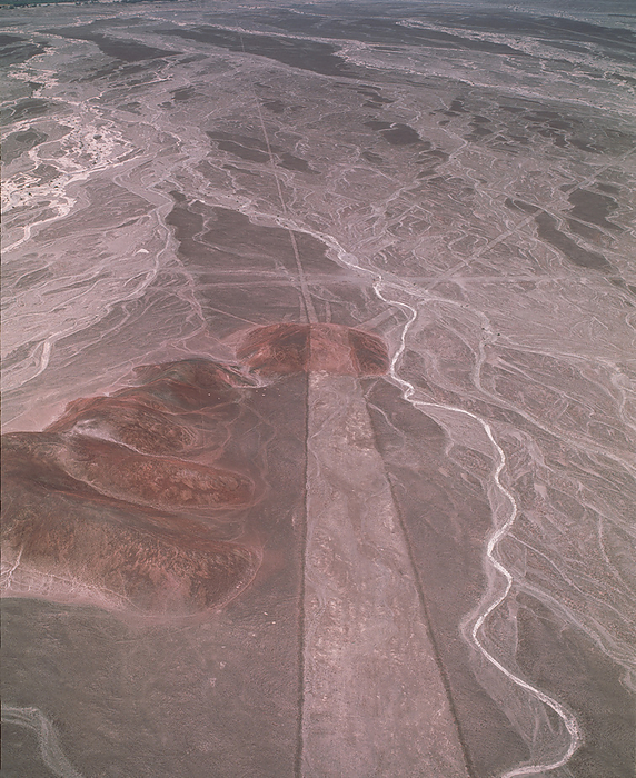 Nazca lines Nazca lines. Aerial photograph of a geoglyph, or landscape drawing, in the coastal desert of southern Peru. This geoglyph consists of a wide strip running from bottom to centre with three lines radiating out from its end. Other geoglyphs  not seen  take the form of stylised animals and unknown objects. They cover huge areas and can only be properly seen from the air. They were made by removing the dark surface stone to reveal a lighter stone layer underneath. They are thought to have been made by the Nazca, a native South American people, around 2000 years ago. Theories about the lines have ranged from uses in astronomy  for seasonal agriculture  to uses in religion.