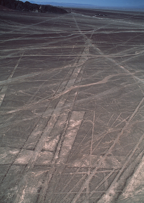 Nazca lines Nazca lines. Aerial photograph of geoglyphs, or landscape drawings, in the coastal desert of southern Peru. These geoglyphs  long rectangular strips  may have been used for astronomical purposes to aid planning of seasonal agriculture. Other geoglyphs  not seen  take the form of stylised animals and other objects, possibly for ceremonial and religious purposes. They cover huge areas and can only be properly seen from the air. They were made by removing the dark surface stone to reveal a lighter stone layer underneath. They are thought to have been made by the Nazca, a native South American people, around 2000 years ago.