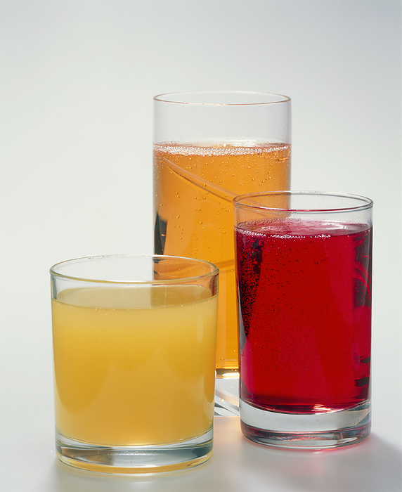 Soft drinks Soft drinks. Glasses containing carbonated and still soft drinks. These contain flavourings, colourings and sugar. The excessive consumption of sugar can contribute to tooth decay.
